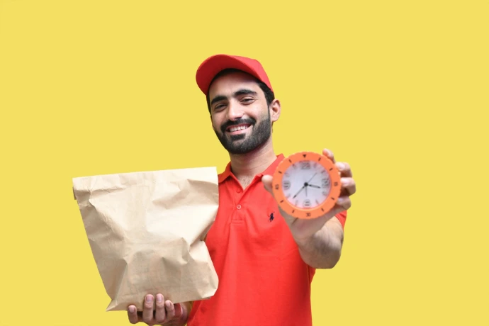 a man holding a clock